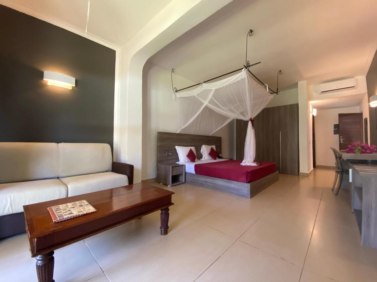 Mini Suite with a terrace door opening to the greenery