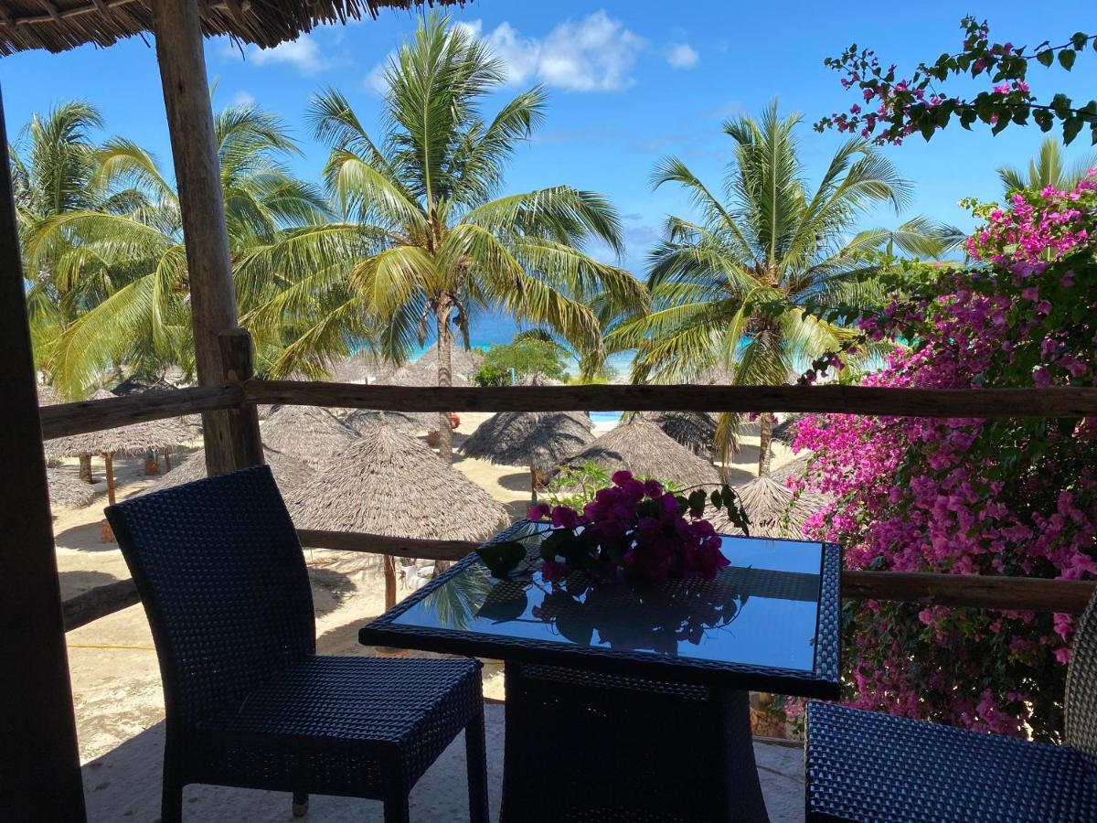 Luxury Villa terrace framed by bougainvillea with a sea view